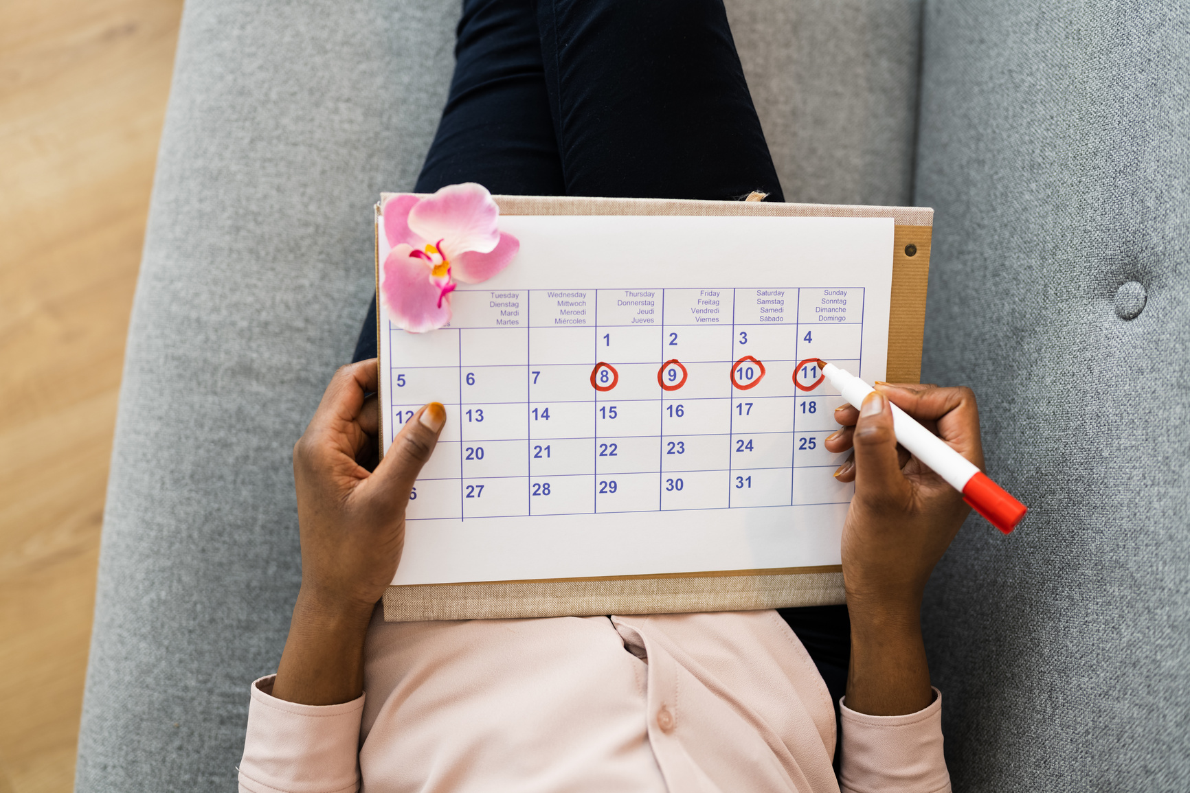 Woman Using Menstrual Cycle Calendar
